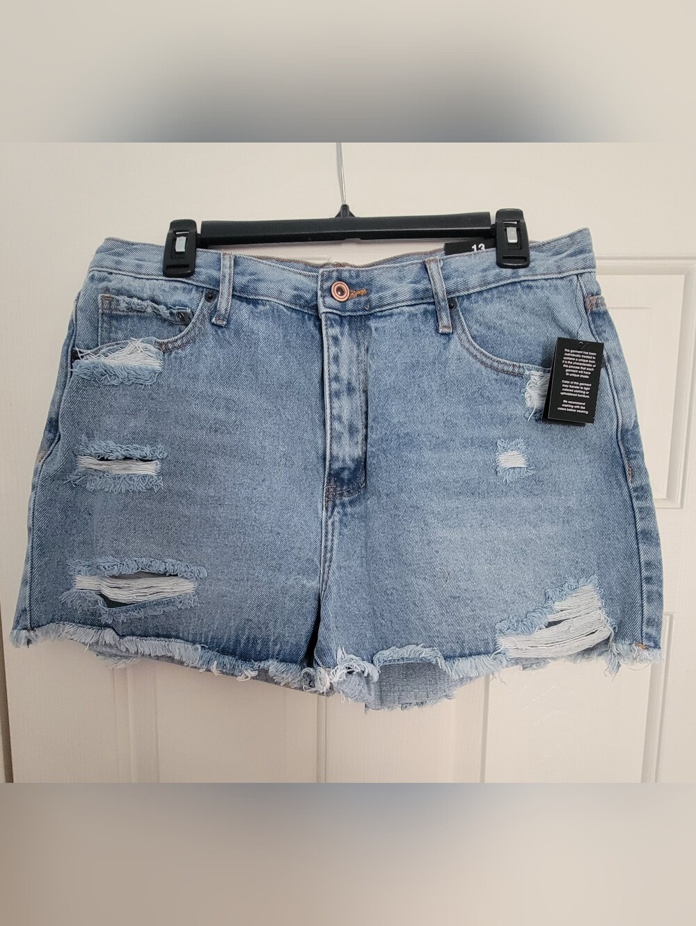 High-Rise Light Blue Distressed Denim Shorts with Frayed Hem